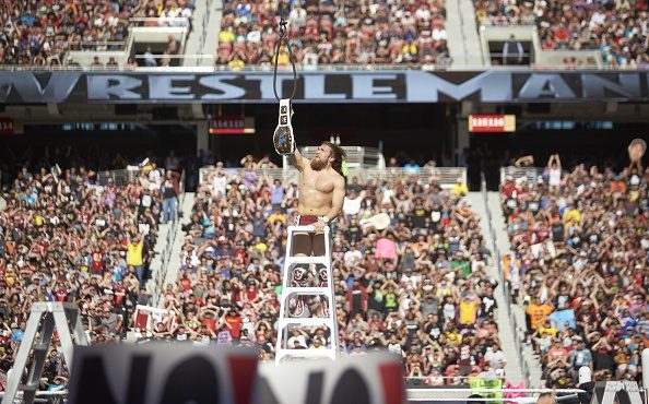 WWE Wrestling: WrestleMania 31: Daniel Bryan victorious on ladder with belt during event at Levi's ...