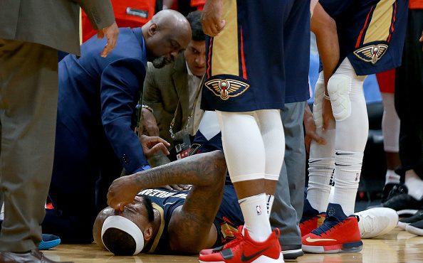 NEW ORLEANS, LA - JANUARY 26:  DeMarcus Cousins #0 of the New Orleans Pelicans lies down on the gro...