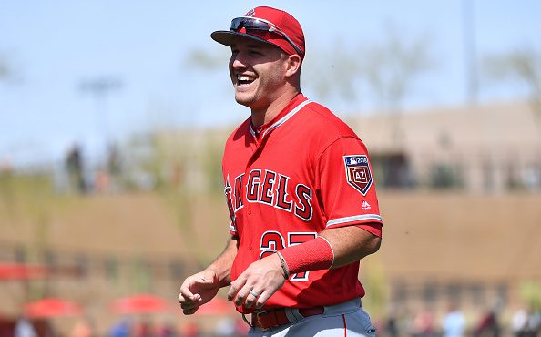 SCOTTSDALE, AZ - MARCH 06:  Mike Trout #27 of the Los Angeles Angels smiles while warming up for th...