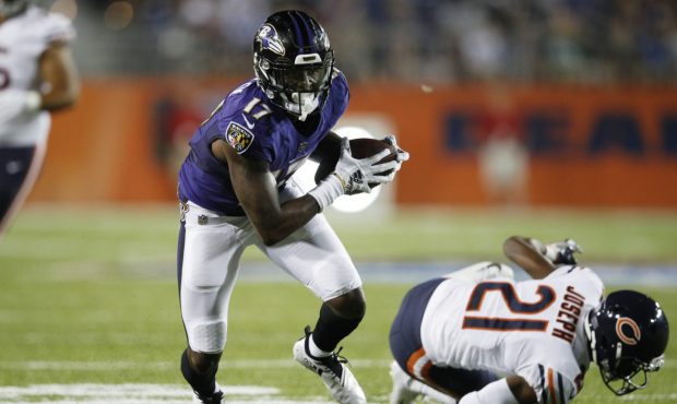 CANTON, OH - AUGUST 02: Jordan Lasley #17 of the Baltimore Ravens breaks a tackle after a reception...