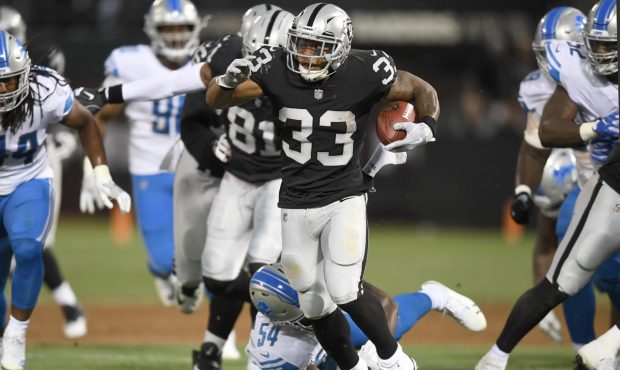 OAKLAND, CA - AUGUST 10:  DeAndre Washington #33 of the Oakland Raiders carries the ball against th...
