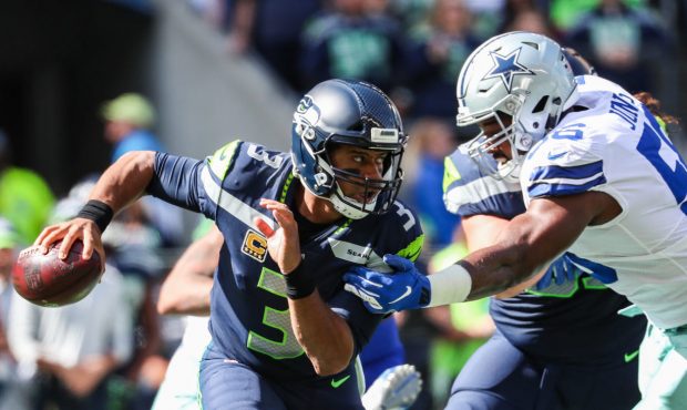 SEATTLE, WA - SEPTEMBER 23: Quarterback Russell Wilson #3 of the Seattle Seahawks scrambles during ...