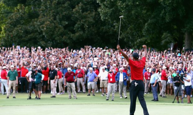 ATLANTA, GA - SEPTEMBER 23: Tiger Woods of the United States celebrates making a par on the 18th gr...