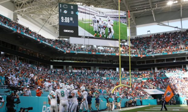 MIAMI, FL - OCTOBER 14: The Miami Dolphins celebrate a two-point coversion in the fourth quarter ag...
