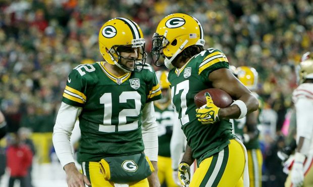 GREEN BAY, WI - OCTOBER 15: Aaron Rodgers #12 and Davante Adams #17 of the Green Bay Packers celebr...