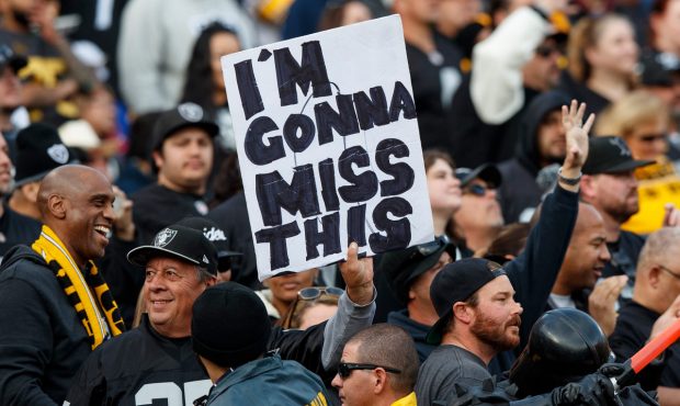 OAKLAND, CA - DECEMBER 09: An Oakland Raiders fan holds up a sign indicating he will miss the team ...