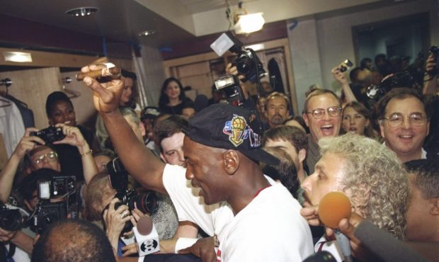 13 Jun 1997: Michael Jordan of the Chicago Bulls celebrates in the locker room after the Bulls win ...