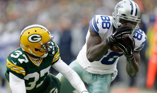 GREEN BAY, WI - JANUARY 11: Dez Bryant #88 of the Dallas Cowboys attempts a catch over Sam Shields ...