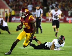LOS ANGELES, CA - SEPTEMBER 05: Isaac Whitney #15 of the USC Trojanst runs by Rocky Hayes #3 of the Arkansas State Red Wolves after his catch during the first quarter at Los Angeles Coliseum on September 5, 2015 in Los Angeles, California. (Photo by Harry How/Getty Images)