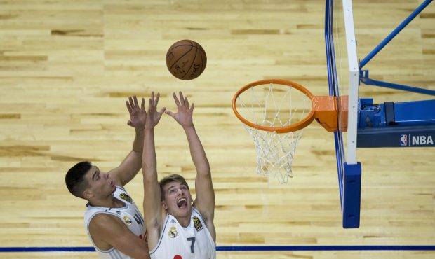 MADRID, SPAIN - OCTOBER 08: Luka Doncic (R) of Real Madrid and his teammate Guillermo Hernangomez (...