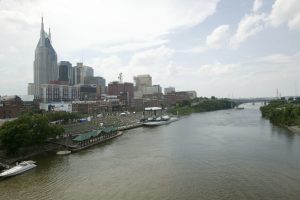 NASHVILLE - JUNE 10: The skyline of Nashville is seen with riverfront concert stage and midway during the 2004 CMA Music Festival, formerly known as FanFair June 10, 2004 in Nashville, Tenessee. The four-day festival is the largest in country music. (Photo by Rusty Russell/Getty Images)