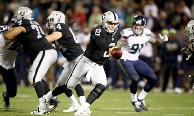 OAKLAND, CA - SEPTEMBER 01: Connor Cook #8 of the Oakland Raiders drops back to hand off the ball a...