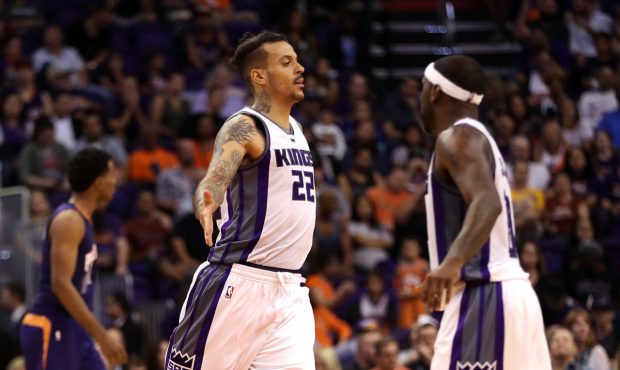 Matt Barnes #22 of the Sacramento Kings high fives Ty Lawson #10 after scoring against the Phoenix ...