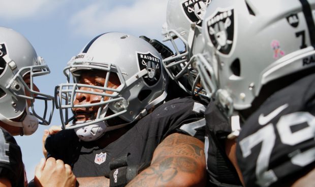 TAMPA, FL - OCTOBER 30: Tackle Donald Penn #72 of the Oakland Raiders is congratulated by teammates...