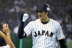 TOKYO, JAPAN - NOVEMBER 12: Shohei Ohtani #16 of Japan celebrates after hitting a solo homer in the fifth inning during the international friendly match between Japan and Netherlands at the Tokyo Dome on November 12, 2016 in Tokyo, Japan.
