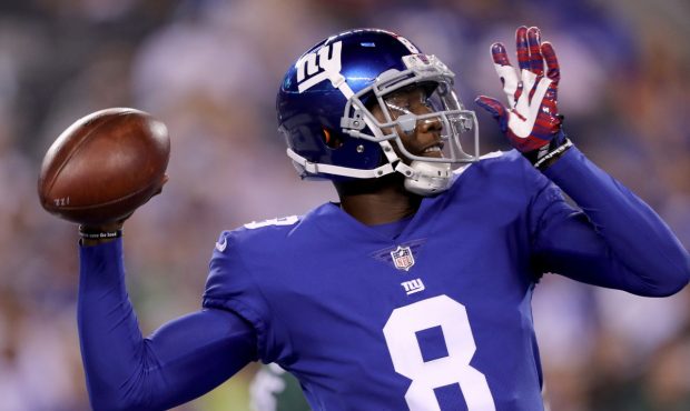 EAST RUTHERFORD, NJ - AUGUST 26: Josh Johnson #8 of the New York Giants passes the ball in the firs...