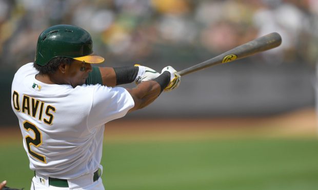OAKLAND, CA - SEPTEMBER 24: Khris Davis #2 of the Oakland Athletics hits a two-run homer against th...