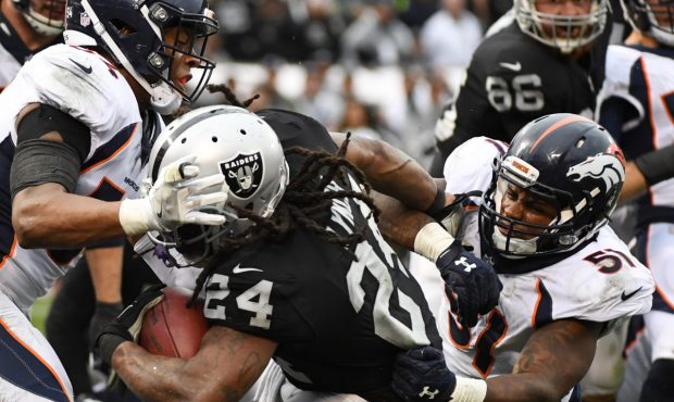OAKLAND, CA - NOVEMBER 26: Marshawn Lynch #24 of the Oakland Raiders rushes for a touchdown against...
