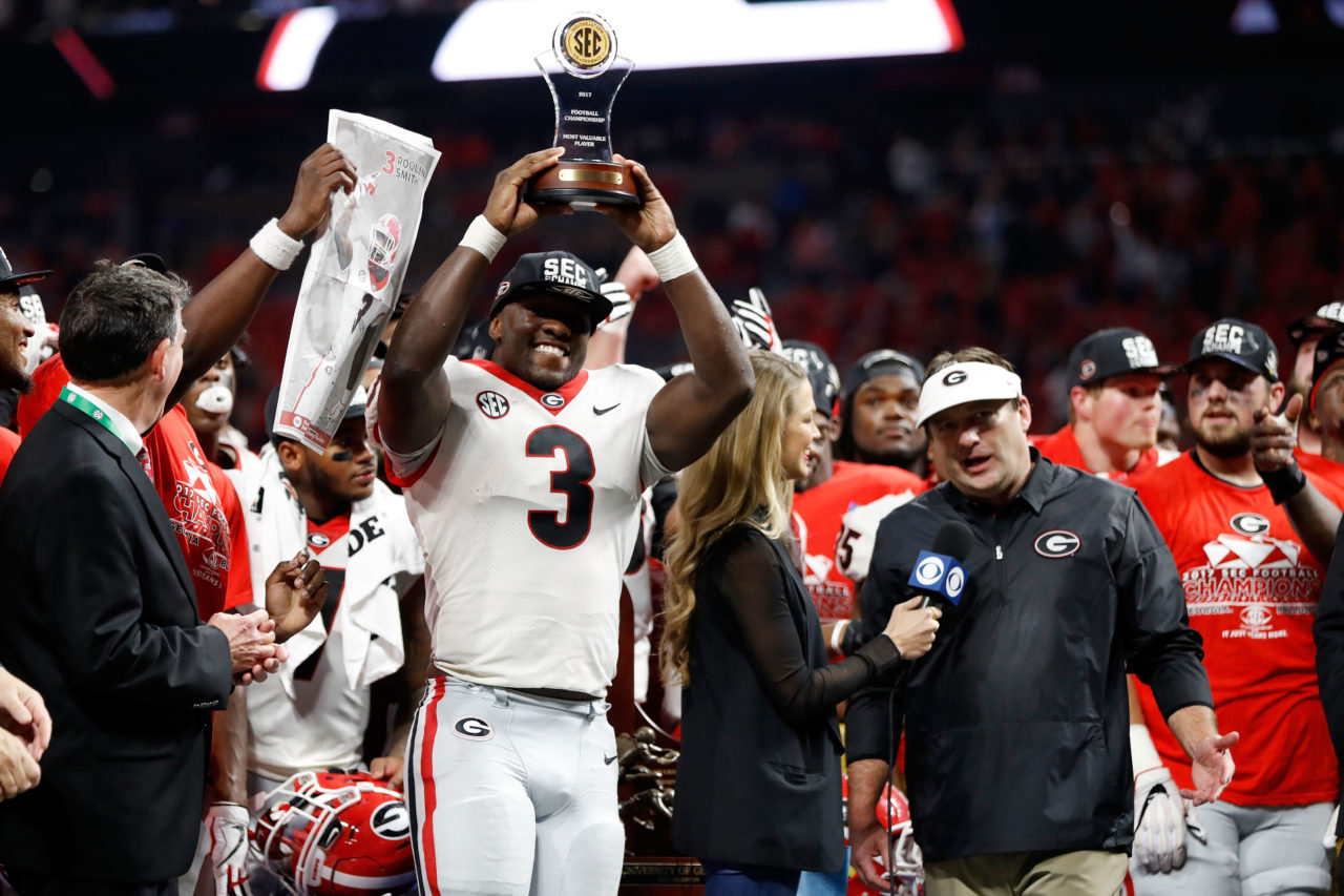 ATLANTA, GA - DECEMBER 02: Roquan Smith #3 of the Georgia Bulldogs reacts to winning the game MVP trophy after beating the Auburn Tigers in the SEC Championship at Mercedes-Benz Stadium on December 2, 2017 in Atlanta, Georgia. 