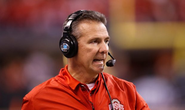 INDIANAPOLIS, IN - DECEMBER 02: Head coach Urban Meyer of the Ohio State Buckeyes looks on as they ...