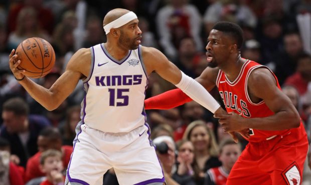 Vince Carter #15 of the Sacramento Kings looks to pass against David Nwaba #11 of the Chicago Bulls...