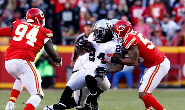 KANSAS CITY, MO - DECEMBER 10:  Running back Marshawn Lynch #24 of the Oakland Raiders carries the ...
