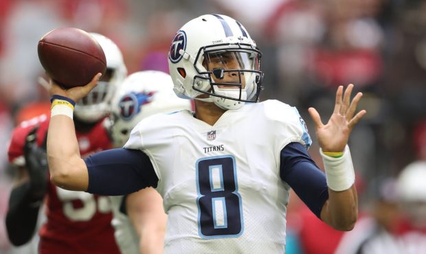 GLENDALE, AZ - DECEMBER 10: Marcus Mariota #8 of the Tennessee Titans looks to make a pass in the f...