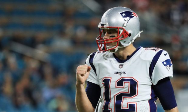 MIAMI GARDENS, FL - DECEMBER 11: Tom Brady #12 of the New England Patriots celebrates a touchdown i...