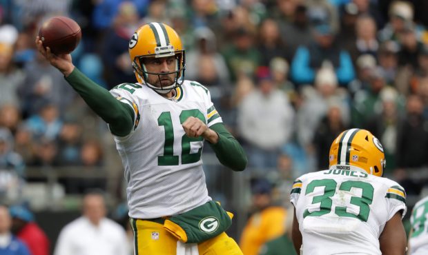 CHARLOTTE, NC - DECEMBER 17: Aaron Rodgers #12 of the Green Bay Packers throws a pass against the C...