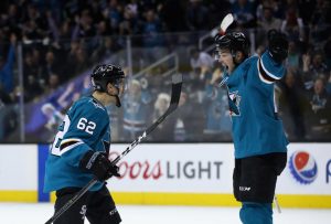 SAN JOSE, CA - DECEMBER 21: Kevin Labanc #62 and Tomas Hertl #48 of the San Jose Sharks celebrate after Labanc scored the game-winning goal in overtime against the Vancouver Canucks at SAP Center on December 21, 2017 in San Jose, California.