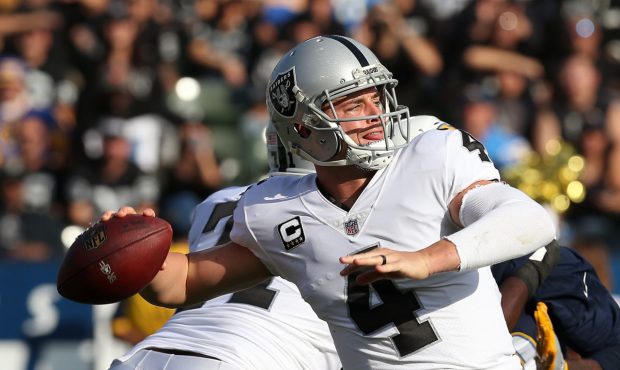 CARSON, CA - DECEMBER 31: Derek Carr #4 of the Oakland Raiders throws a pass during the first half ...