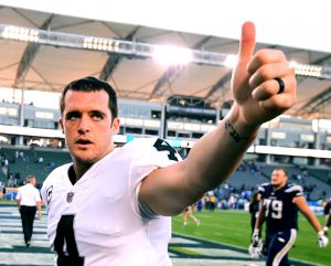 CARSON, CA - DECEMBER 31:  Derek Carr #4 of the Oakland Raiders reacts as he leaves the field after 30-10 loss to the Los Angeles Chargers at StubHub Center on December 31, 2017 in Carson, California.  (Photo by Harry How/Getty Images)