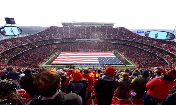 KANSAS CITY, MO - JANUARY 6: Fans stand at attention for the national anthem overlooking a 100 yard...