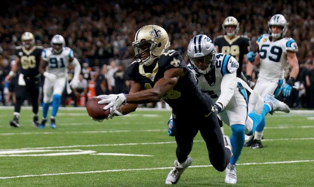 NEW ORLEANS, LA - JANUARY 07:  Michael Thomas #13 of the New Orleans Saints catches a pass over Jam...
