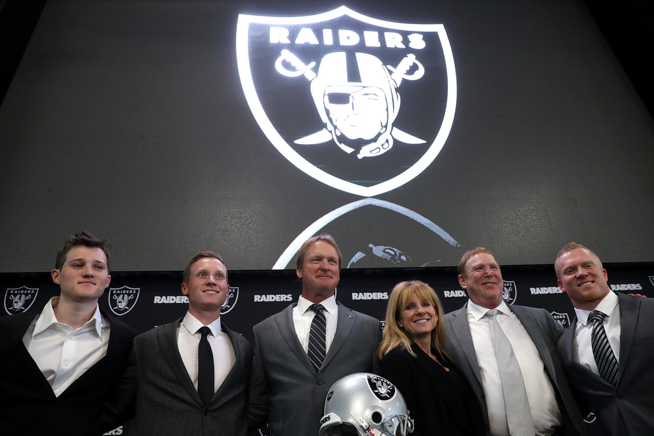 ALAMEDA, CA - JANUARY 09: Oakland Raiders new head coach Jon Gruden (C) poses for a photo with members of his family during a news conference at Oakland Raiders headquarters on January 9, 2018 in Alameda, California. Jon Gruden has returned to the Oakland Raiders after leaving the team in 2001. 