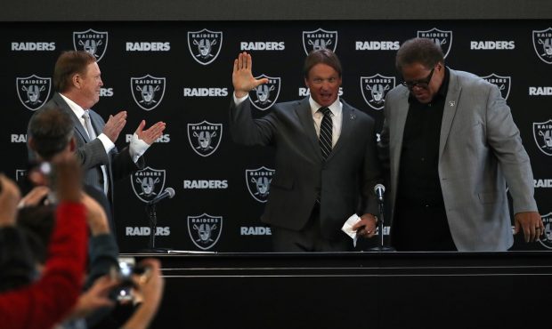 ALAMEDA, CA - JANUARY 09: Oakland Raiders new head coach Jon Gruden (C) waves to attendees during a...