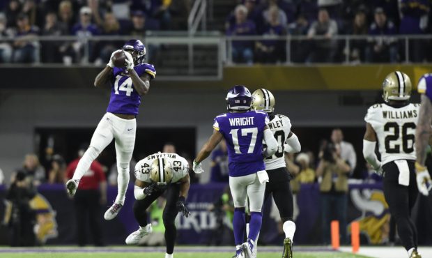 MINNEAPOLIS, MN - JANUARY 14: Stefon Diggs #14 of the Minnesota Vikings leaps to catch the ball in ...