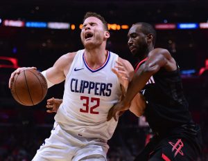 LOS ANGELES, CA - JANUARY 15: Blake Griffin #32 of the LA Clippers reacts as he posts up Luc Mbah a Moute #12 of the Houston Rockets during a 113-102 Clipper win at Staples Center on January 15, 2018 in Los Angeles, California. (Photo by Harry How/Getty Images)