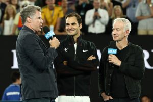 MELBOURNE, AUSTRALIA - JANUARY 16: Will Ferrell (L) and John McEnroe (R) interview Roger Federer of Switzerland after Federer won his first round match against Aljaz Bedene of Slovenia on day two of the 2018 Australian Open at Melbourne Park on January 16, 2018 in Melbourne, Australia. (Photo by Ryan Pierse/Getty Images)