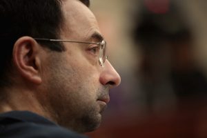 LANSING, MI - JANUARY 17: Larry Nassar listens to victim impact statements during his sentencing hearing after being accused of molesting more than 100 girls while he was a physician for USA Gymnastics and Michigan State University where he had his sports-medicine practice on January 17, 2018 in Lansing, Michigan. Nassar has pleaded guilty in Ingham County, Michigan, to sexually assaulting seven girls, but the judge is allowing all his accusers to speak. Nassar is currently serving a 60-year sentence in federal prison for possession of child pornography. (Photo by Scott Olson/Getty Images)