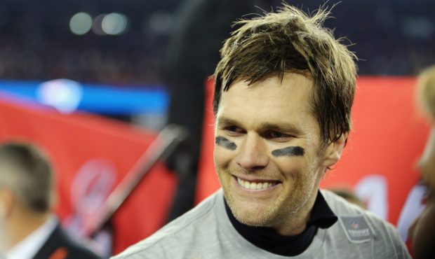 FOXBOROUGH, MA - JANUARY 21: Tom Brady #12 of the New England Patriots reacts after winning the AFC...