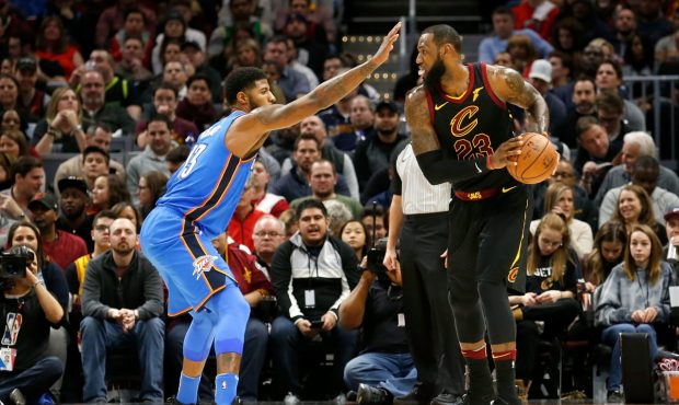 CLEVELAND, OH - JANUARY 20: Paul George #13 of the Oklahoma City Thunder defends against LeBron Jam...
