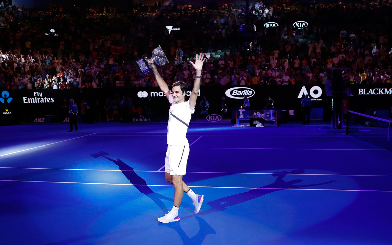 MELBOURNE, AUSTRALIA - JANUARY 28: Roger Federer of Switzerland waves to the crowd as he leaves the court with the Norman Brookes Challenge Cup after winning the 2018 Australian Open Men's Singles Final against Marin Cilic of Croatia on day 14 of the 2018 Australian Open at Melbourne Park on January 28, 2018 in Melbourne, Australia.