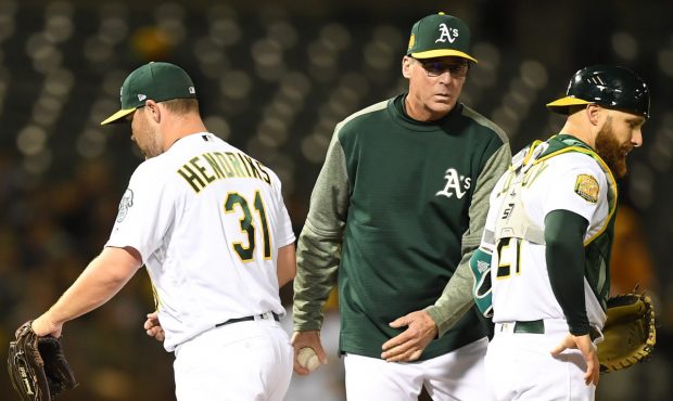 OAKLAND, CA - APRIL 03: Manager Bob Melvin #6 of the Oakland Athletics takes the ball from relief p...