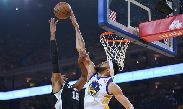 OAKLAND, CA - APRIL 14:  JaVale McGee #1 of the Golden State Warriors blocks the shot of LaMarcus A...