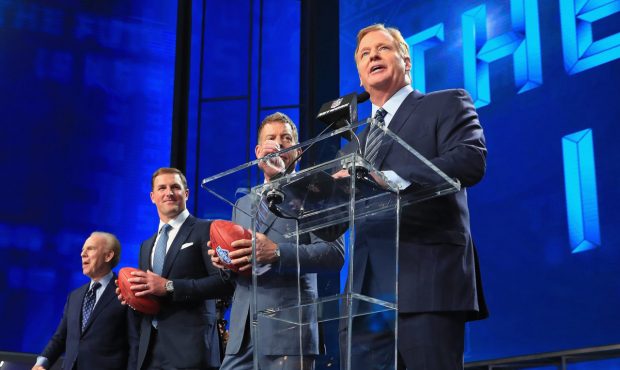 ARLINGTON, TX - APRIL 26: NFL Commissioner Roger Goodell stands onstage with Troy Aikman, Jason Wit...
