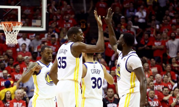 HOUSTON, TX - MAY 14: Kevin Durant #35 of the Golden State Warriors reacts with Draymond Green #23 ...