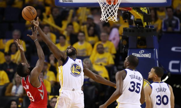 OAKLAND, CA - MAY 20: Draymond Green #23 of the Golden State Warriors tips the ball over James Hard...
