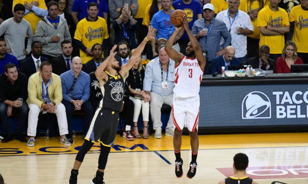 OAKLAND, CA - MAY 22: Chris Paul #3 of the Houston Rockets takes a shot against Stephen Curry #30 o...