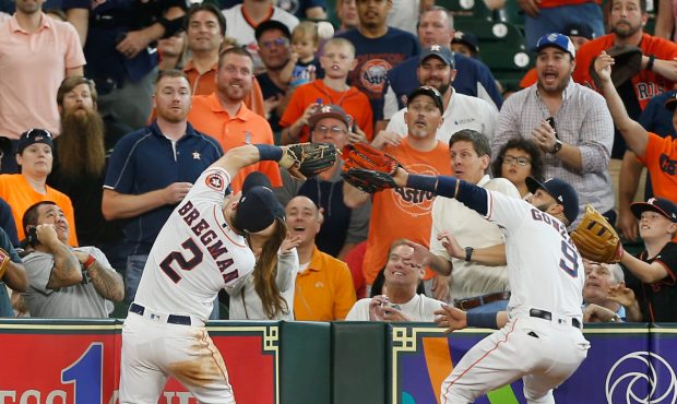HOUSTON, TX - MAY 23:  Marwin Gonzalez #9 of the Houston Astros makes a catch in foul territory on ...